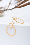 Large Golden circle stud earrings with a crystal