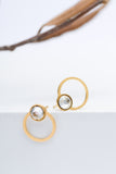 Golden circle stud earrings with a crystal