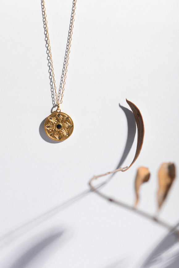 Golden coin necklace with black swarovski crystal