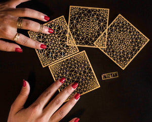 MIZYAN - a set of 4 gold plated coasters